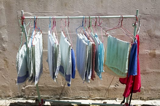 cement wall domestic street drying clothes