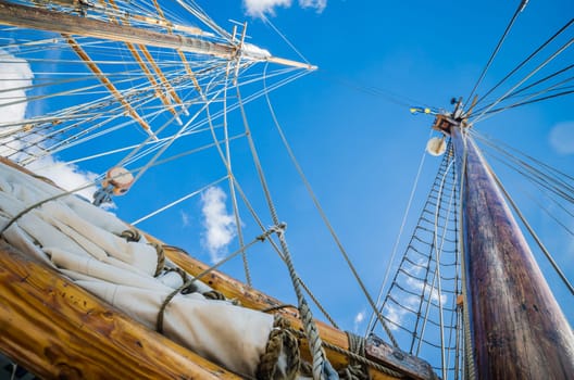 Folded sail and mast on an old sailboat