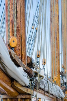 Folded sail and mast on an old sailboat