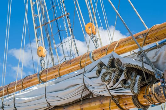 Folded sail and mast on an old sailboat