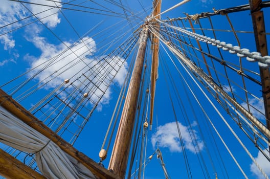 Folded sail and mast on an old sailboat