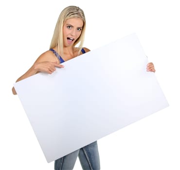 Beautiful young lady pointing to a sign board which she is holding
