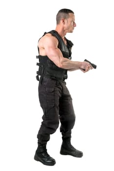 Man with tactical vest and gun isolated in white