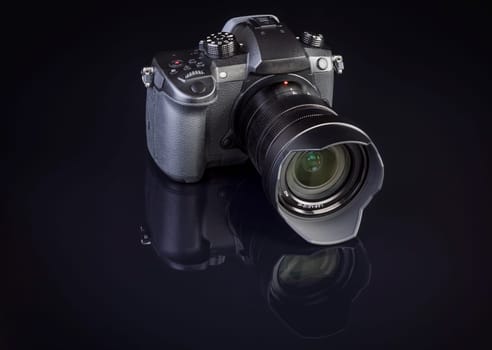 dslr photocamera on black background