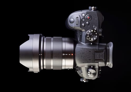 dslr photocamera on black background