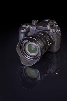 dslr photocamera on black background