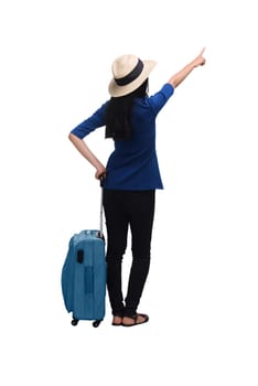Young asian woman traveler with hat carrying suitcase isolated over white background