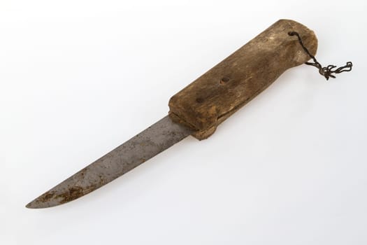 Old knife with wooden handle on a light background