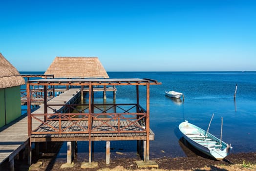 View of a pier and boats in the town of Champoton, Mexico