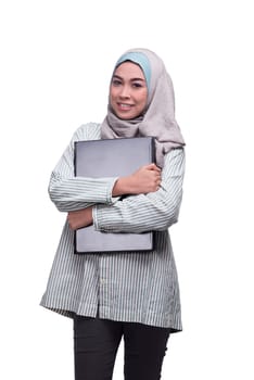 Smiling asian muslim woman with laptop isolated over white background