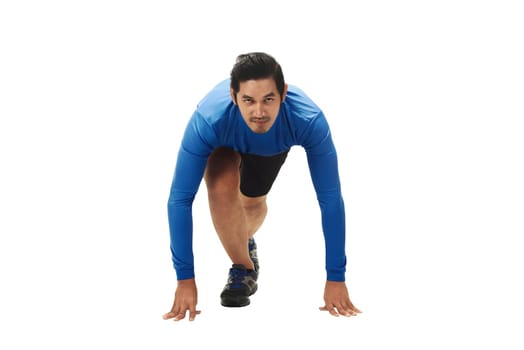 Young asian man on ready position to run isolated over white background