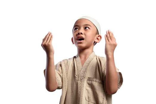 Asian muslim kid with white cap praying to god isolated over white background