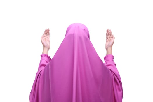 Back view asian muslim woman with veil praying isolated over white background