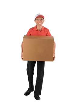 Young asian courier holding a big parcel isolated against white background