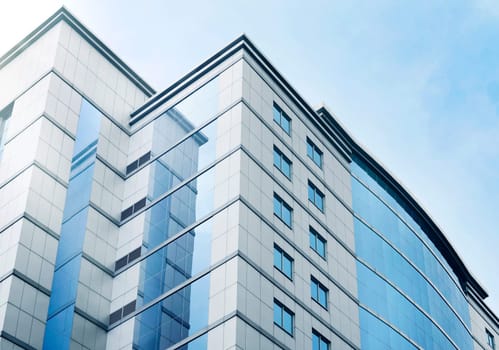 Windows of business office building with blue sky in the city