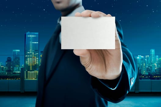 Business man holding name card isolated over white background