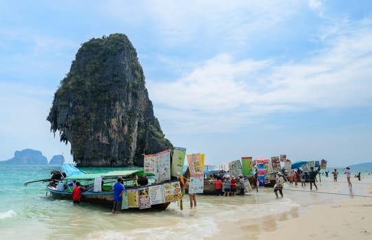 KRABI, THAILAND - APRIL 12, 2016 : Long-Tailed boats Food and drink vendor at Railay beach with high limestone cliffs in Krabi province, Thailand.