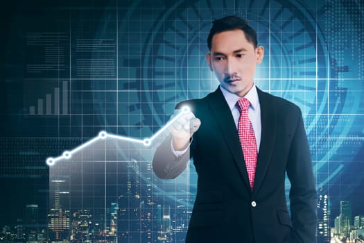 Asian businessman with hand pointing digital chart on virtual screen background
