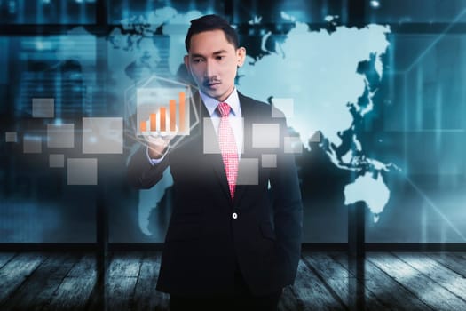 Attractive asian businessman touching digital chart with finger on virtual screen