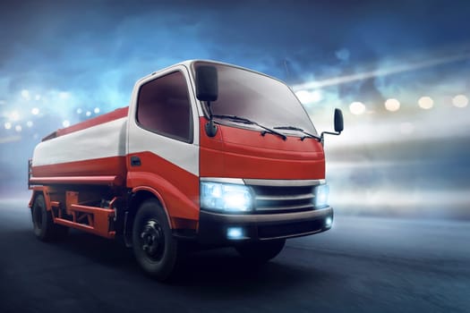 Truck with fuel tank along the asphalt road with dark concrete background