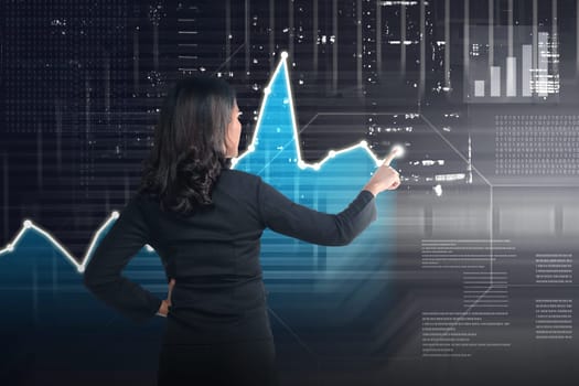 Asian business woman drawing digital graph on virtual screen background