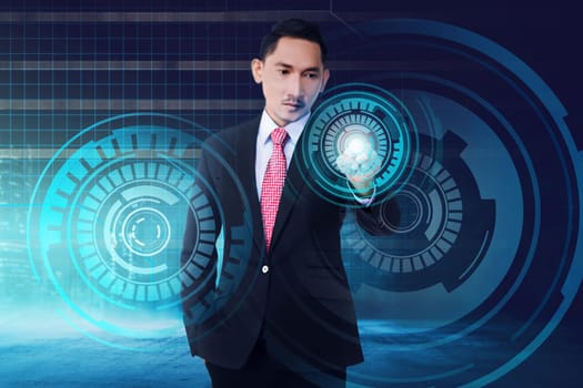 Young asian businessman touching digital screen with finger on digital background