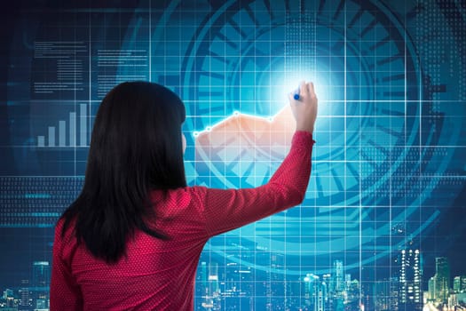 Asian business woman drawing digital chart on virtual screen background