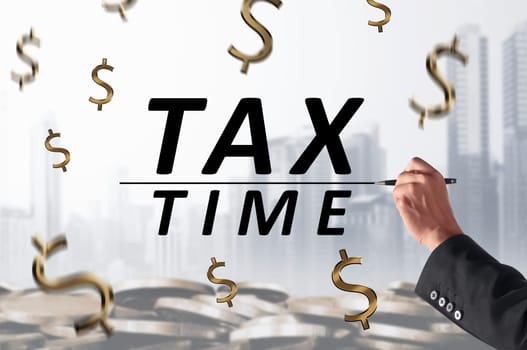 Business person hand with pen writing Tax Time with line on whiteboard