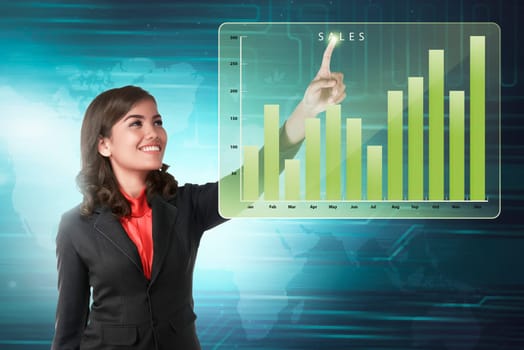 Asian business woman touching marketing sales income chart on virtual screen