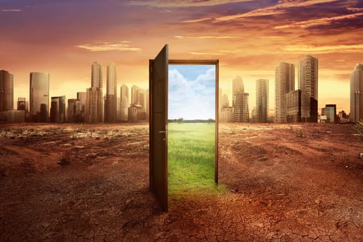 Found new world with green environment from open wooden door against cityscape background