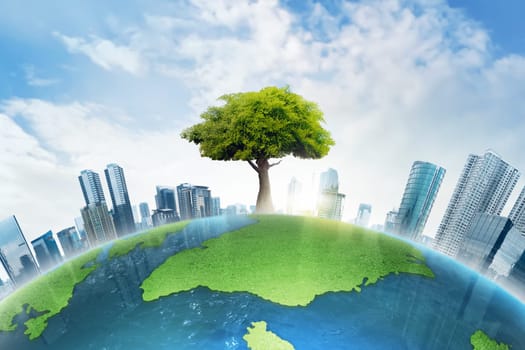 The big tree growing between modern building on top of the earth
