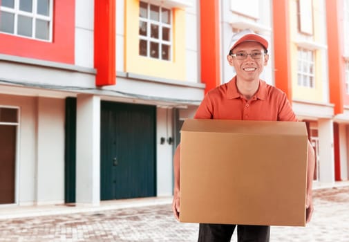Professional asian courier delivering the package in the city