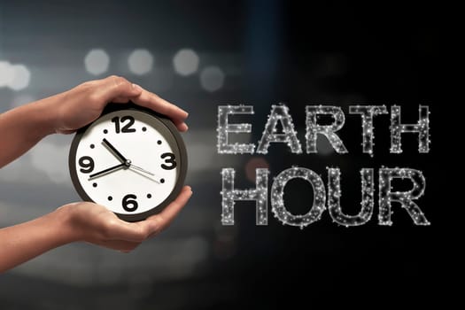 Turn off the light in 60 minute with Earth Hour message on blurred light background