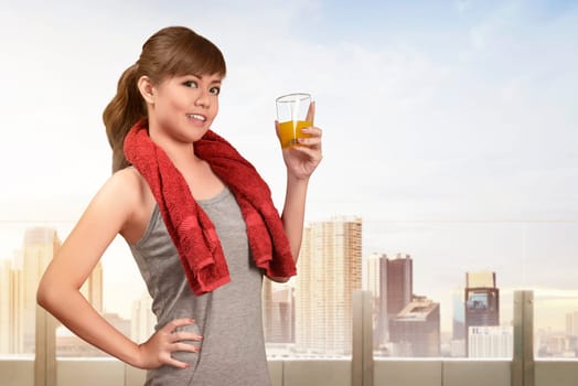 Smiling asian woman drinking a healthy natural juice for healthy diet concept