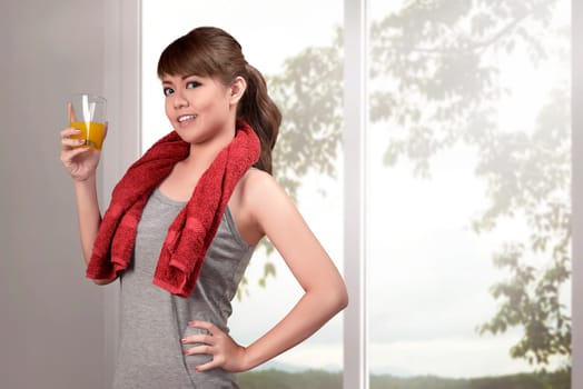 Beautiful asian woman drinking a healthy natural juice for healthy at home