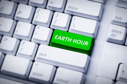 Earth hour on green and white keyboard button. Earth Hour Concept.