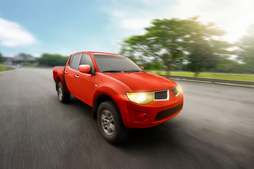 Red four door pickup truck with high speed on highway
