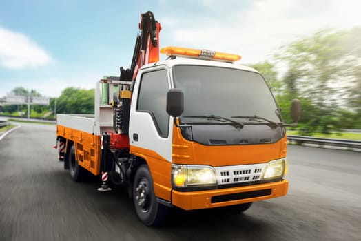 Tow truck patrolled on highway at city