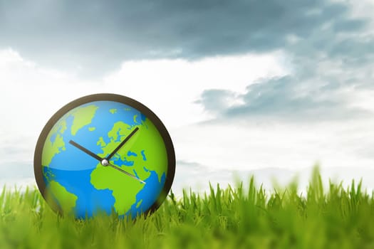 Clock of globe on the meadow. Earth Hour Concept.