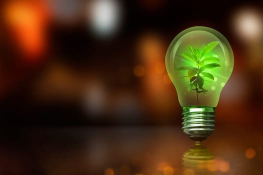 Small plant inside light bulb with blurred light. Earth Hour Concept.