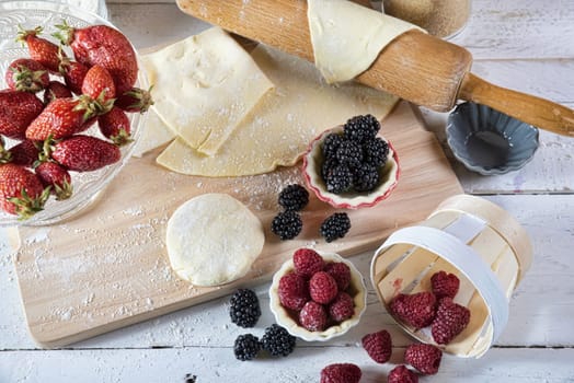 preparation for cake with red fruit with dough