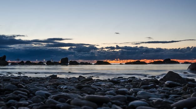 Sunset on the Baltic Sea, stony shore
