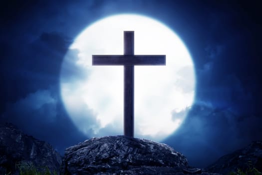 Wooden crosses standing on rock hill with moonlight at night