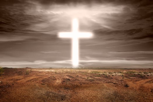Bright shaped cross on the sky in dry land
