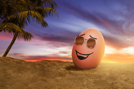 Happy easter eggs with sunglasses in the beach at sunset