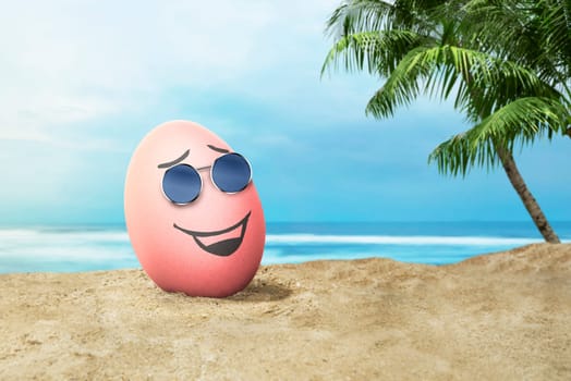 Happy easter eggs with sunglasses in the beach at sunset at day