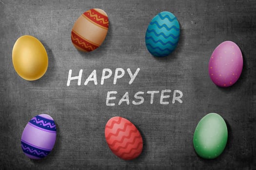Colorful easter eggs with happy easter greeting on blackboard