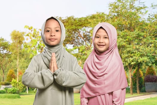 Two asian muslim girl celebrating ramadan together in the park