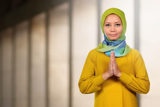 Beautiful asian muslim woman praying in the mosque
