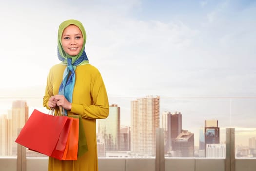 Young asian muslim woman enjoying shopping time in the city